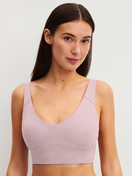 Women model is wearing Bustier with adjustable straps made of Modal in Purple, Unicoloured from the Natural Skin series by CALIDA, Front view