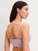 Women model is wearing Bustier with adjustable straps made of Modal in Purple, Unicoloured from the Natural Skin series by CALIDA, Back view