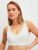 Women model is wearing Bustier with adjustable straps made of Modal in White, Unicoloured from the Natural Skin series by CALIDA, Front view