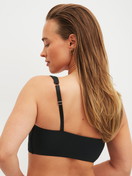Women model is wearing Bustier with adjustable straps made of Modal in Black, Unicoloured from the Natural Skin series by CALIDA, Back view