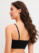 Damen-Model trägt Bustier aus Modal in Schwarz, Einfarbig aus Serie Seamless Natural von CALIDA, Rückansicht