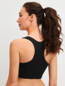 Women model is wearing Bustier made of Modal in Black, Unicoloured from the Seamless Natural series by CALIDA, Back view