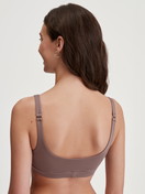 Women model is wearing Bustier made of Modal in Brown, Unicoloured from the Natural Skin series by CALIDA, Back view