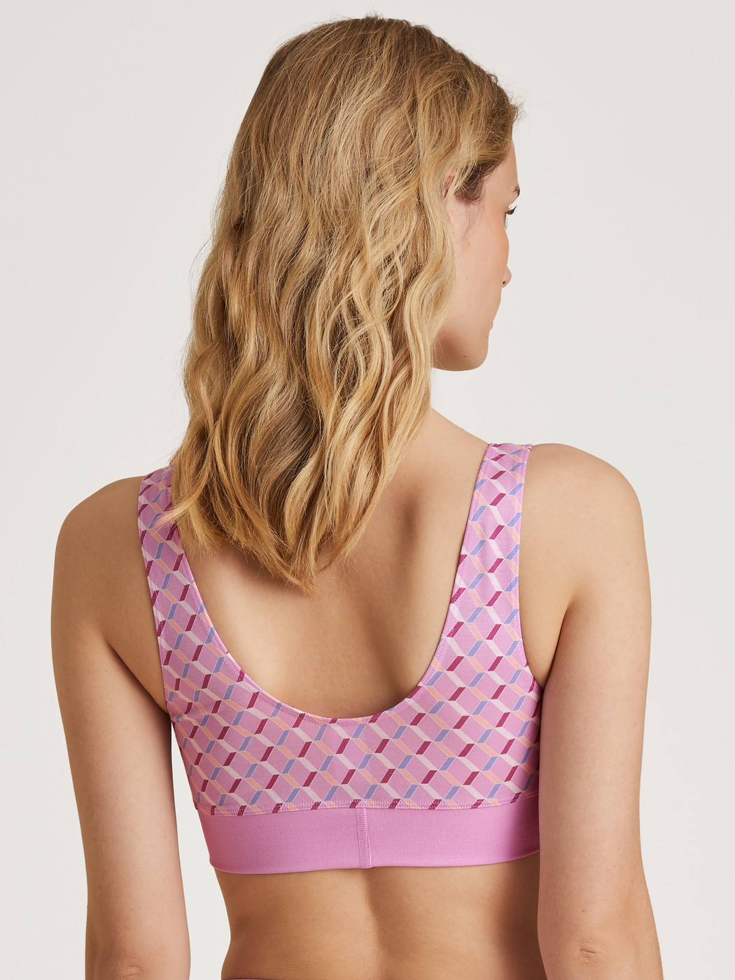 Women model is wearing Bustier made of Cotton in Pink, Motif from the Elastic Trend series by CALIDA, Back view