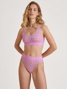 Women model is wearing Bustier made of Cotton in Pink, Motif from the Elastic Trend series by CALIDA, Front view, Outfit