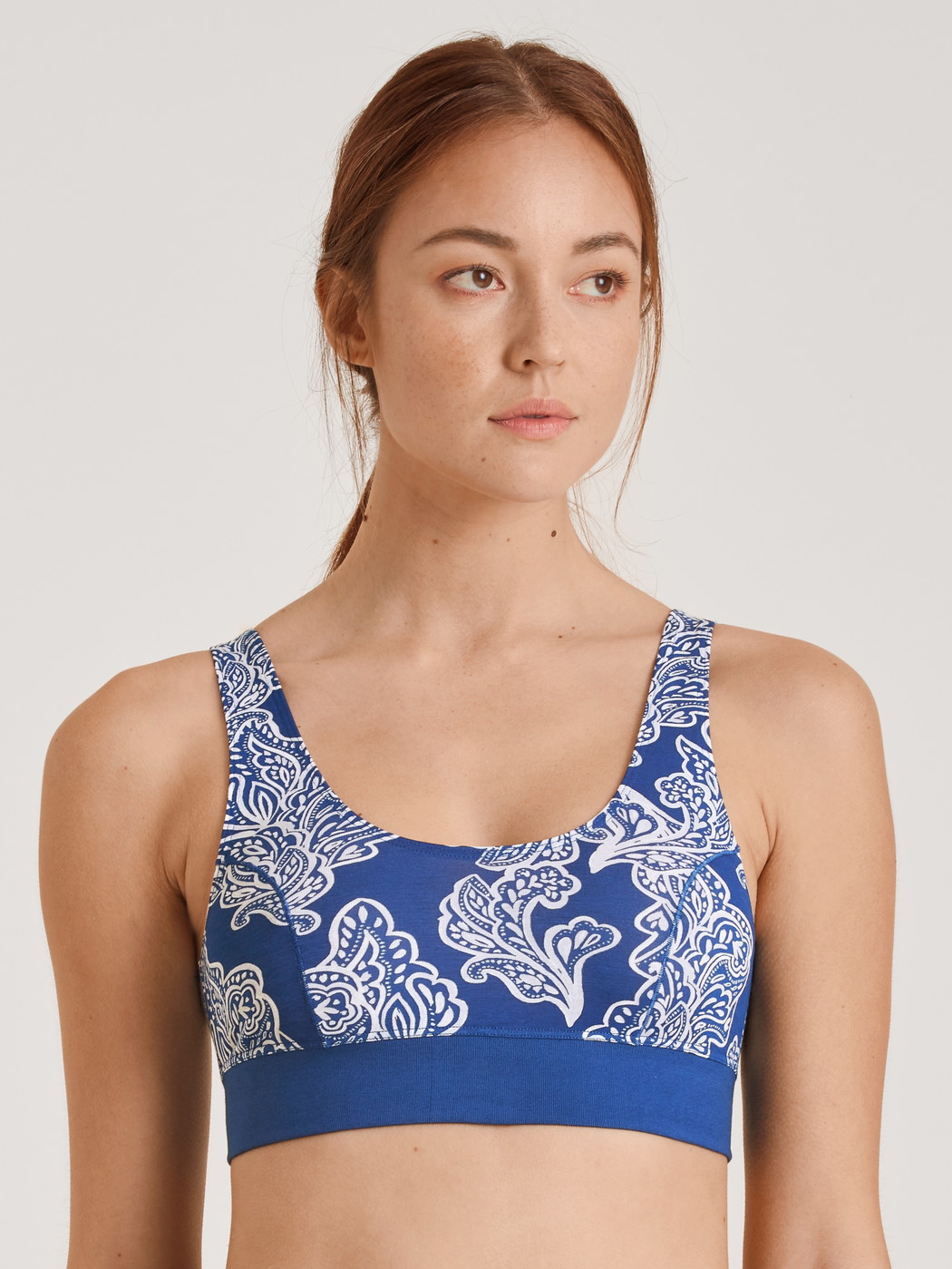 Women model is wearing Bustier made of Cotton in Blue, Motif from the Elastic Trend series by CALIDA, Front view