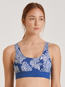 Women model is wearing Bustier made of Cotton in Blue, Motif from the Elastic Trend series by CALIDA, Front view