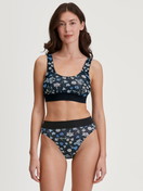 Women model is wearing Bustier made of Cotton in Black, Floral from the Elastic Trend series by CALIDA, Outfit