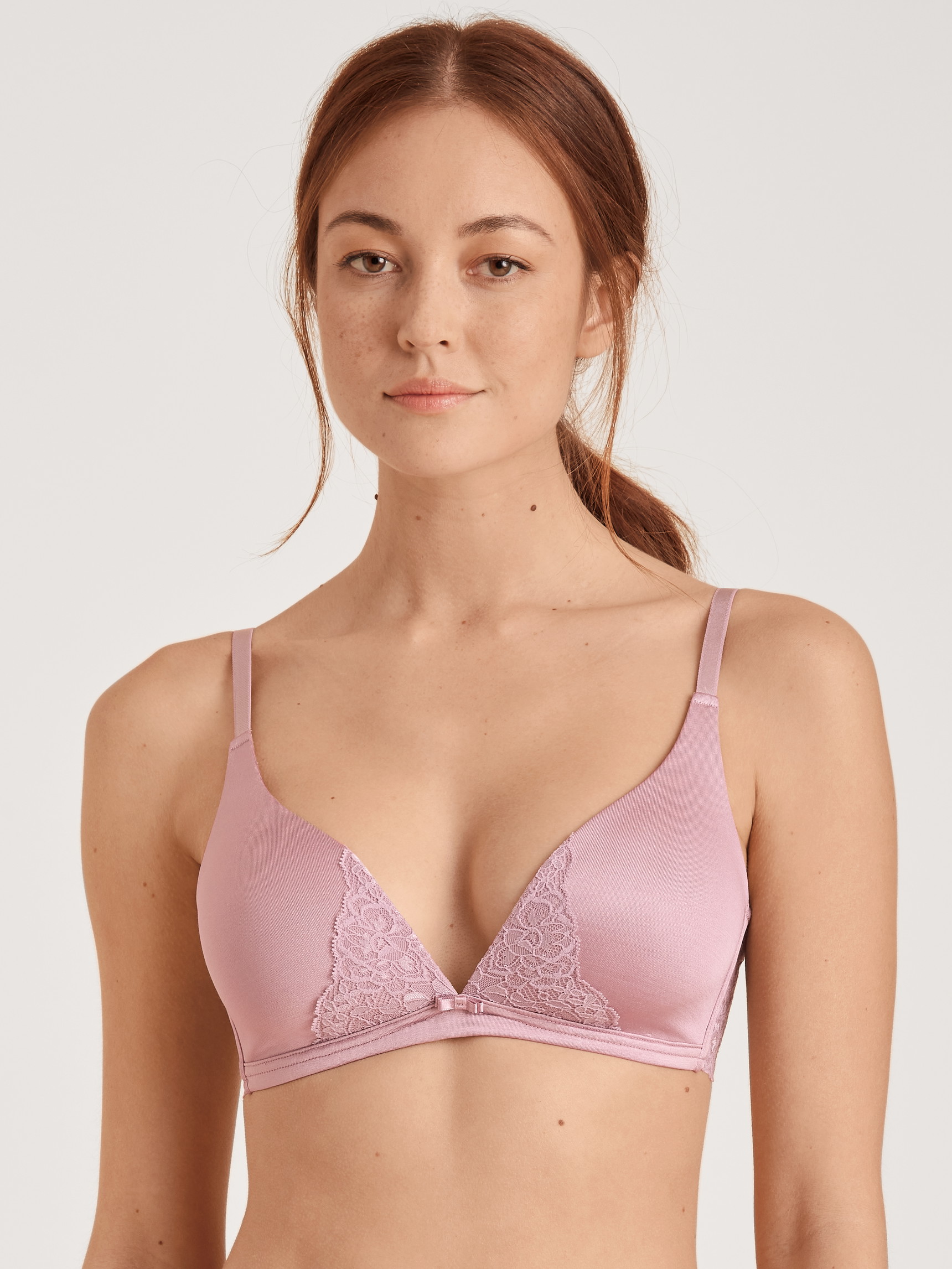 Women model is wearing Triangle bra without underwire made of Viscose in Purple, Lace from the  series by CALIDA, Front view