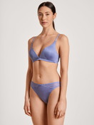 Women model is wearing Triangle bra without underwire made of Cotton in Purple, Lace from the Sensual Secrets series by CALIDA, Front view, Outfit