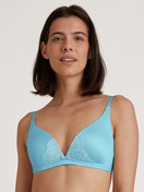 Women model is wearing Triangle bra without underwire made of Viscose in Turquoise, Lace from the Sensual Secrets series by CALIDA, Front view