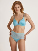 Women model is wearing Triangle bra without underwire made of Viscose in Turquoise, Lace from the Sensual Secrets series by CALIDA, Front view