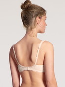 Women model is wearing Soft non-wired bra made of Polyamide in Beige, Lace from the Sensual Secrets series by CALIDA, Back view
