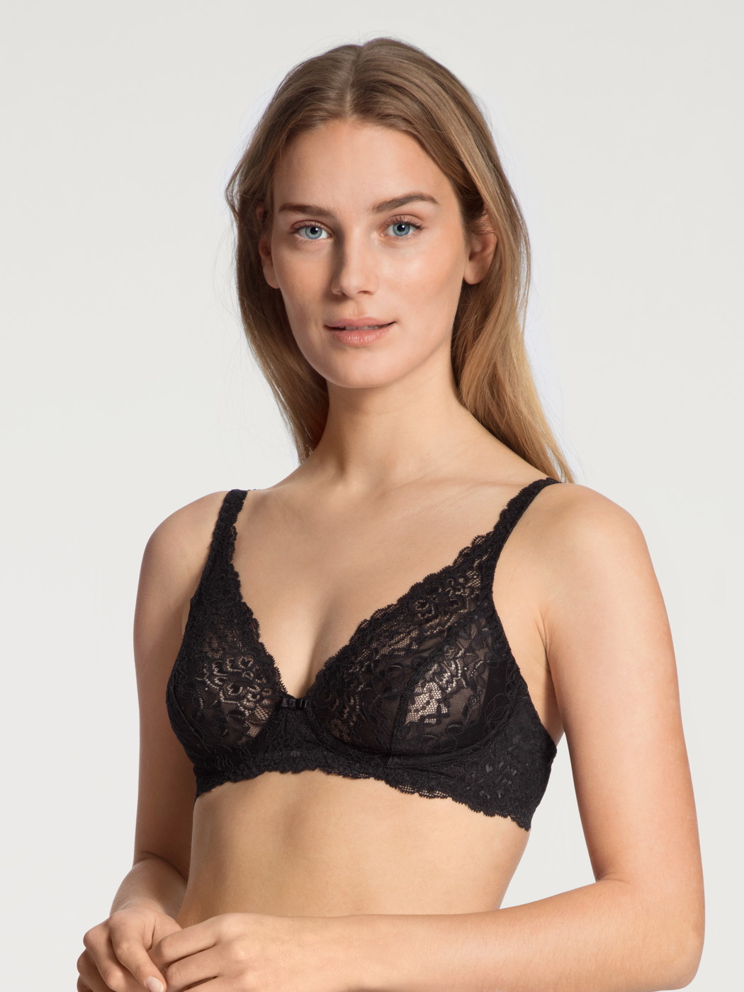 Women model is wearing Soft non-wired bra made of Polyamide in Black, Lace from the Sensual Secrets series by CALIDA, Front view