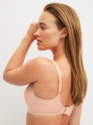 Women model is wearing Bonded Bra made of Modal in Pink, Unicoloured from the Natural Skin series by CALIDA, Back view