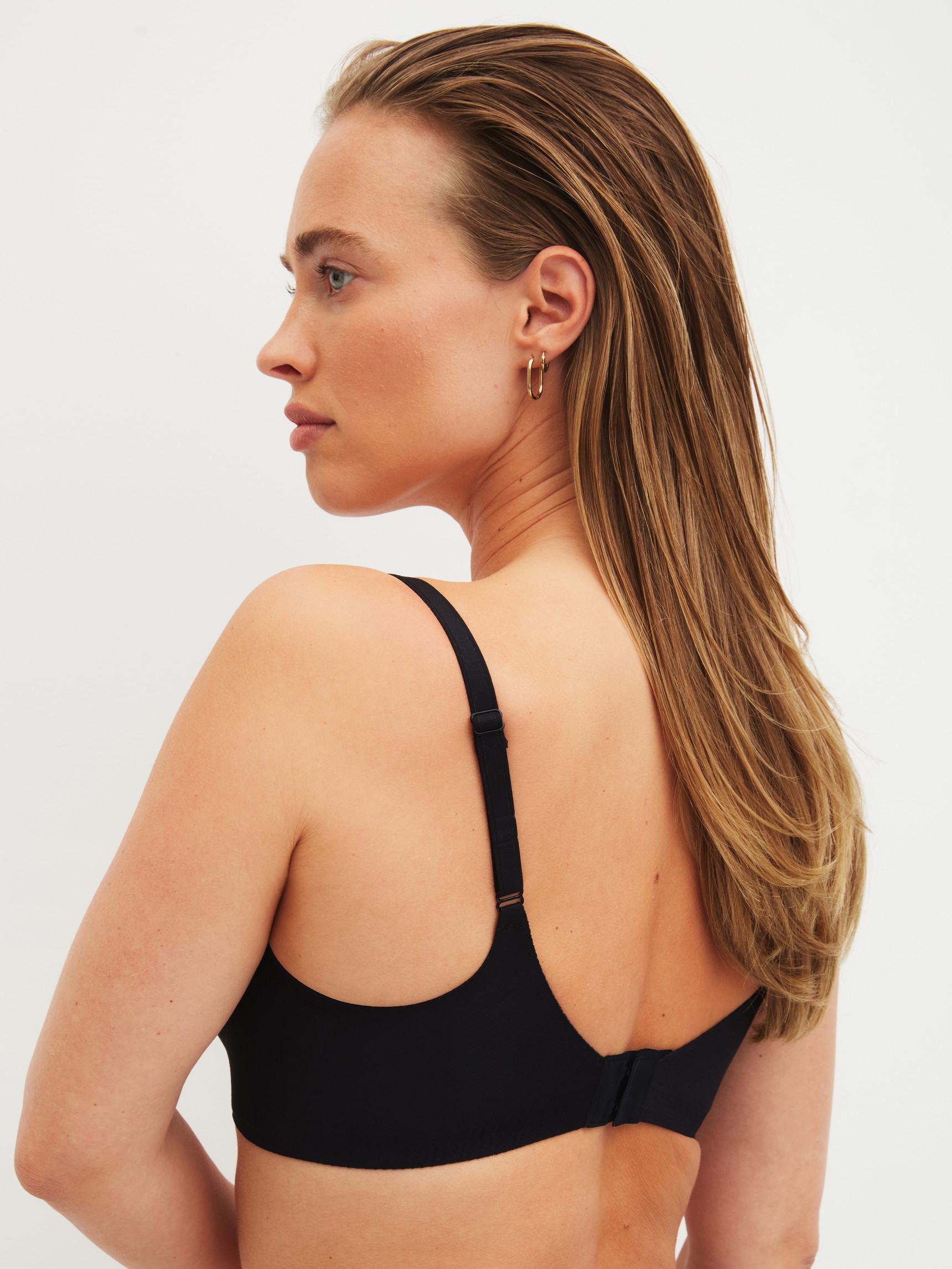 Women model is wearing Bonded Bra made of Modal in Black, Unicoloured from the Natural Skin series by CALIDA, Back view