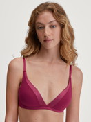 Women model is wearing Soft bra without underwire made of Cotton in Pink, Unicoloured from the Cate series by CALIDA, Front view