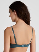 Women model is wearing Soft bra without underwire made of Cotton in Turquoise, Unicoloured from the Cate series by CALIDA, Back view