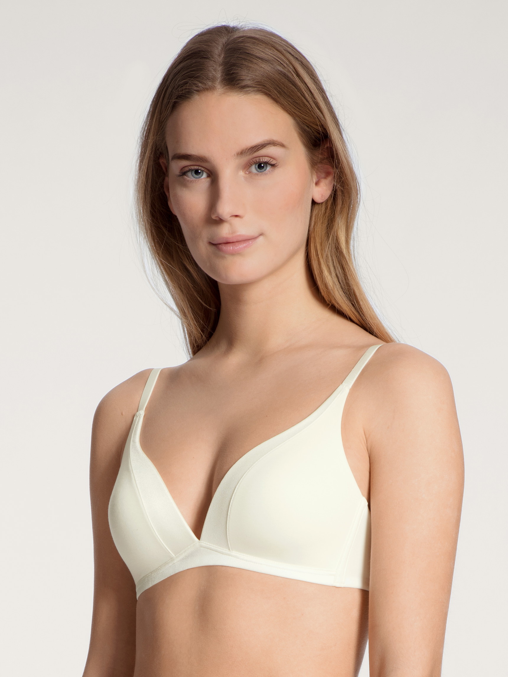 Women model is wearing Soft bra without underwire made of Cotton in White, Unicoloured from the Cate series by CALIDA, Front view