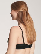Women model is wearing Nursing bra without underwire made of Lyocell in Black, Unicoloured from the 100% Nature Mum series by CALIDA, Back view