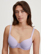 Women model is wearing Spacer bra made of Polyamide in Purple, Lace from the Natural Comfort Lace series by CALIDA, Front view