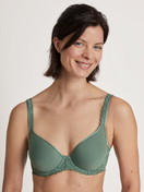 Women model is wearing Spacer bra made of Polyamide in Green, Lace from the Natural Comfort Lace series by CALIDA, Front view