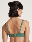 Women model is wearing Spacer bra made of Polyamide in Green, Lace from the Natural Comfort Lace series by CALIDA, Back view