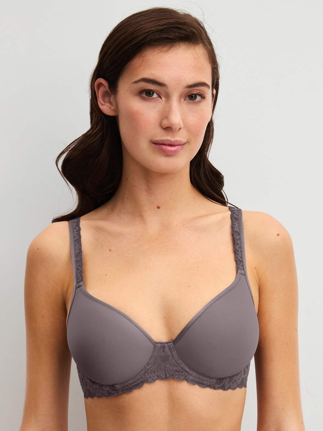 Women model is wearing Spacer bra made of Polyamide in Brown, Lace from the Natural Comfort Lace series by CALIDA, Front view