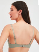 Women model is wearing Underwired T-shirt bra made of Cotton in Green, Unicoloured from the Cate series by CALIDA, Back view