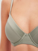 Women model is wearing Underwired T-shirt bra made of Cotton in Green, Unicoloured from the Cate series by CALIDA, Detail