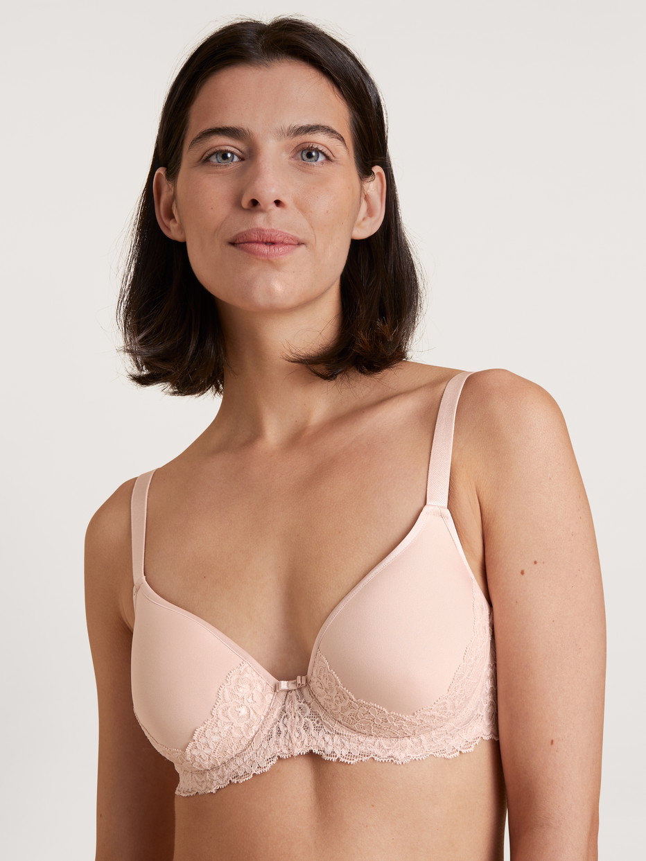 Women model is wearing Spacer bra with wires made of Polyamide in Pink, Lace from the Sensual Secrets series by CALIDA, Front view