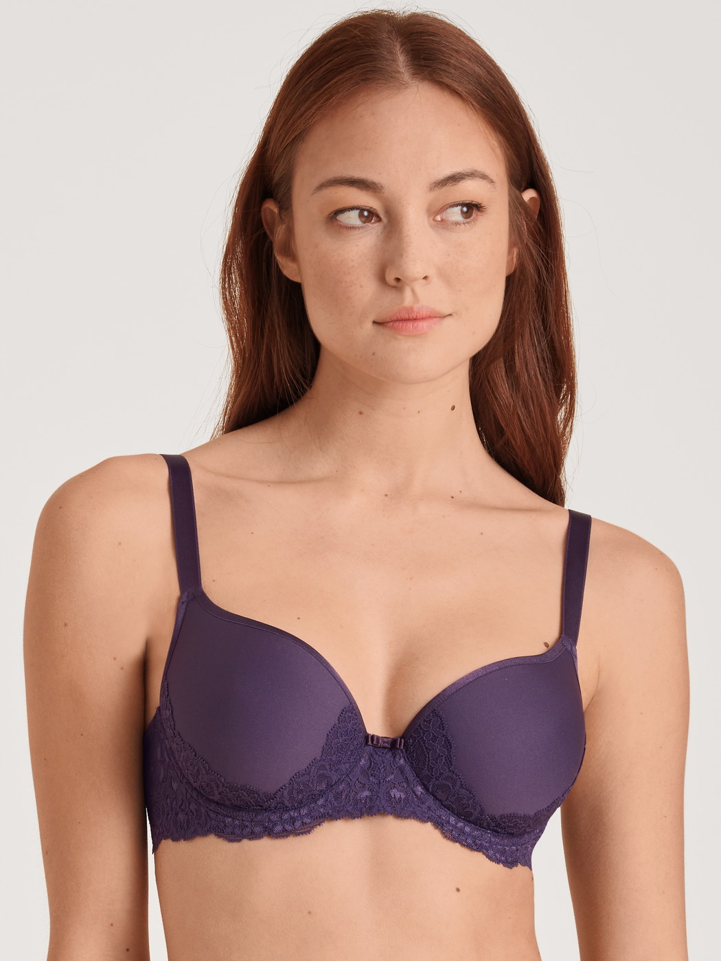 Women model is wearing Spacer bra with wires made of Polyamide in Purple, Lace from the Sensual Secrets series by CALIDA, Front view