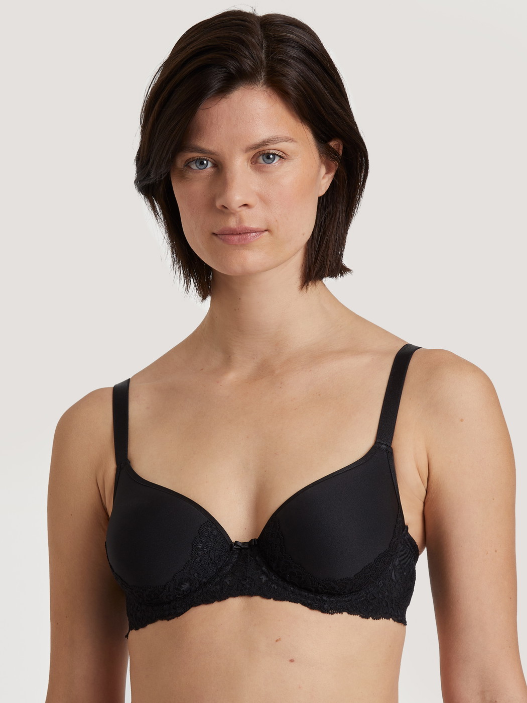 Women model is wearing Spacer bra with wires made of Polyamide in Black, Lace from the Sensual Secrets series by CALIDA, Front view