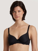 Women model is wearing Spacer bra with wires made of Polyamide in Black, Lace from the Sensual Secrets series by CALIDA, Front view