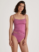 Women model is wearing Spaghetti top made of Cotton in Purple, Lace from the Natural Comfort Lace series by CALIDA, Front view, Outfit