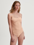Women model is wearing Spaghetti top made of Cotton in Beige, Unicoloured from the Sleek Skin series by CALIDA, Outfit