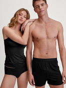 Women model is wearing Spaghetti top made of Cotton in Black, Unicoloured from the Sleek Skin series by CALIDA, Additional Image