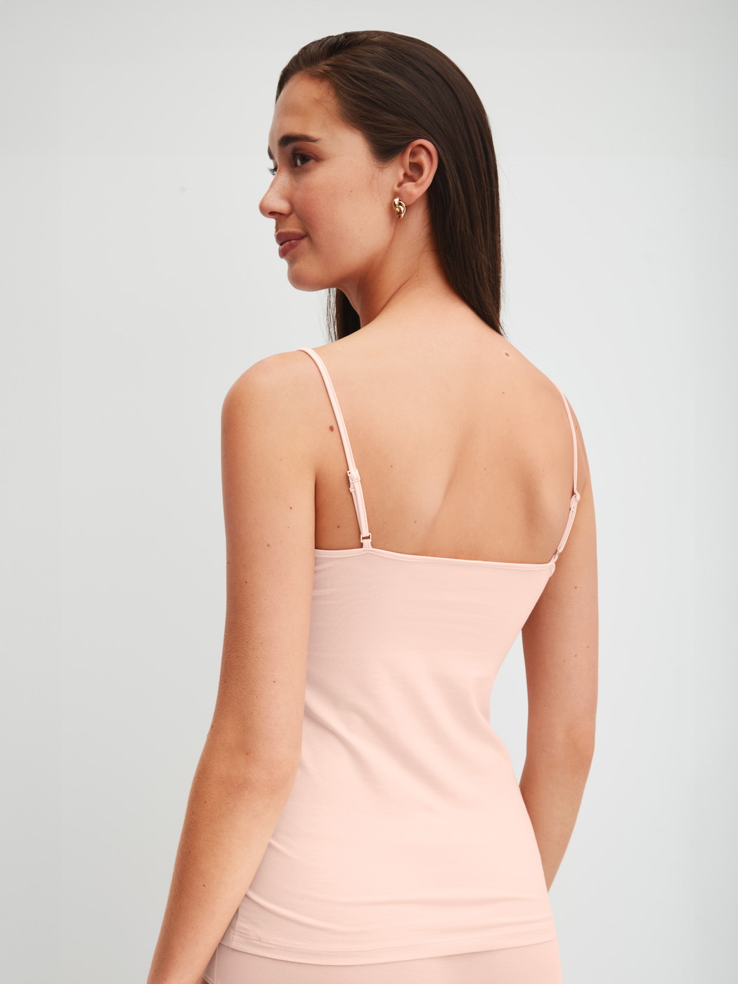 La modella / Il modello Donna indossa Top con spalline in Cotone di colore Rosa, Tinta unita, della serie Cate di CALIDA, Vista posteriore