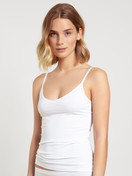 Women model is wearing Spaghetti Top, 2-Pack made of Cotton in White, Unicoloured from the Benefit Women series by CALIDA, Front view