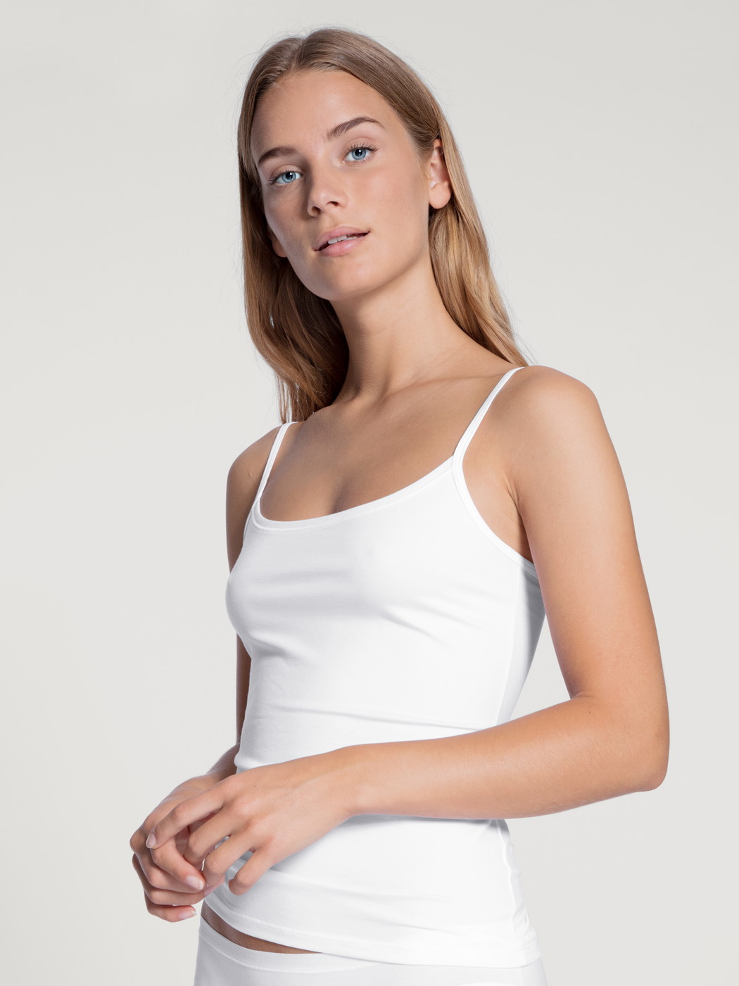Women model is wearing Spaghetti top made of Cotton in White, Unicoloured from the Natural Comfort series by CALIDA, Front view