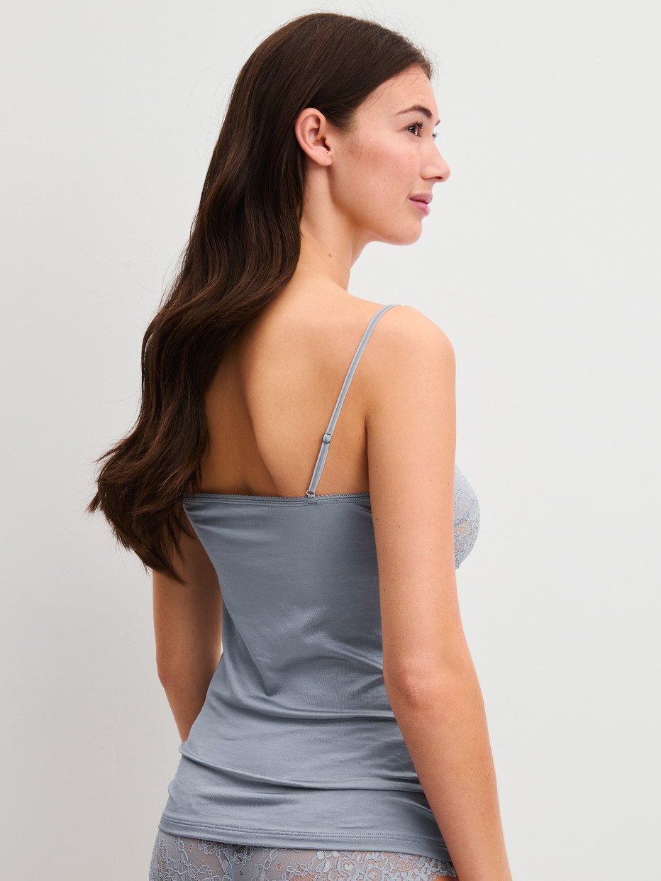 Women model is wearing Spaghetti strap top with lace made of Lace in Grey, Lace from the Sensual Secrets series by CALIDA, Back view