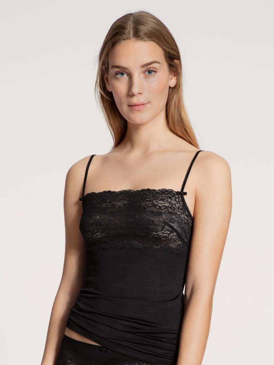 Women model is wearing Spaghetti strap top with lace made of Viscose in Black, Unicoloured from the Sensual Secrets series by CALIDA, Front view