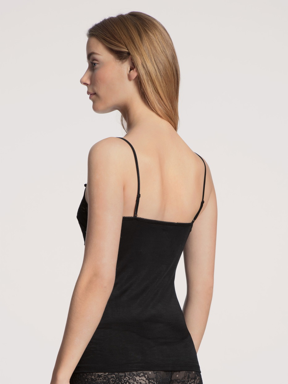 Women model is wearing Spaghetti strap top with lace made of Viscose in Black, Unicoloured from the Sensual Secrets series by CALIDA, Back view