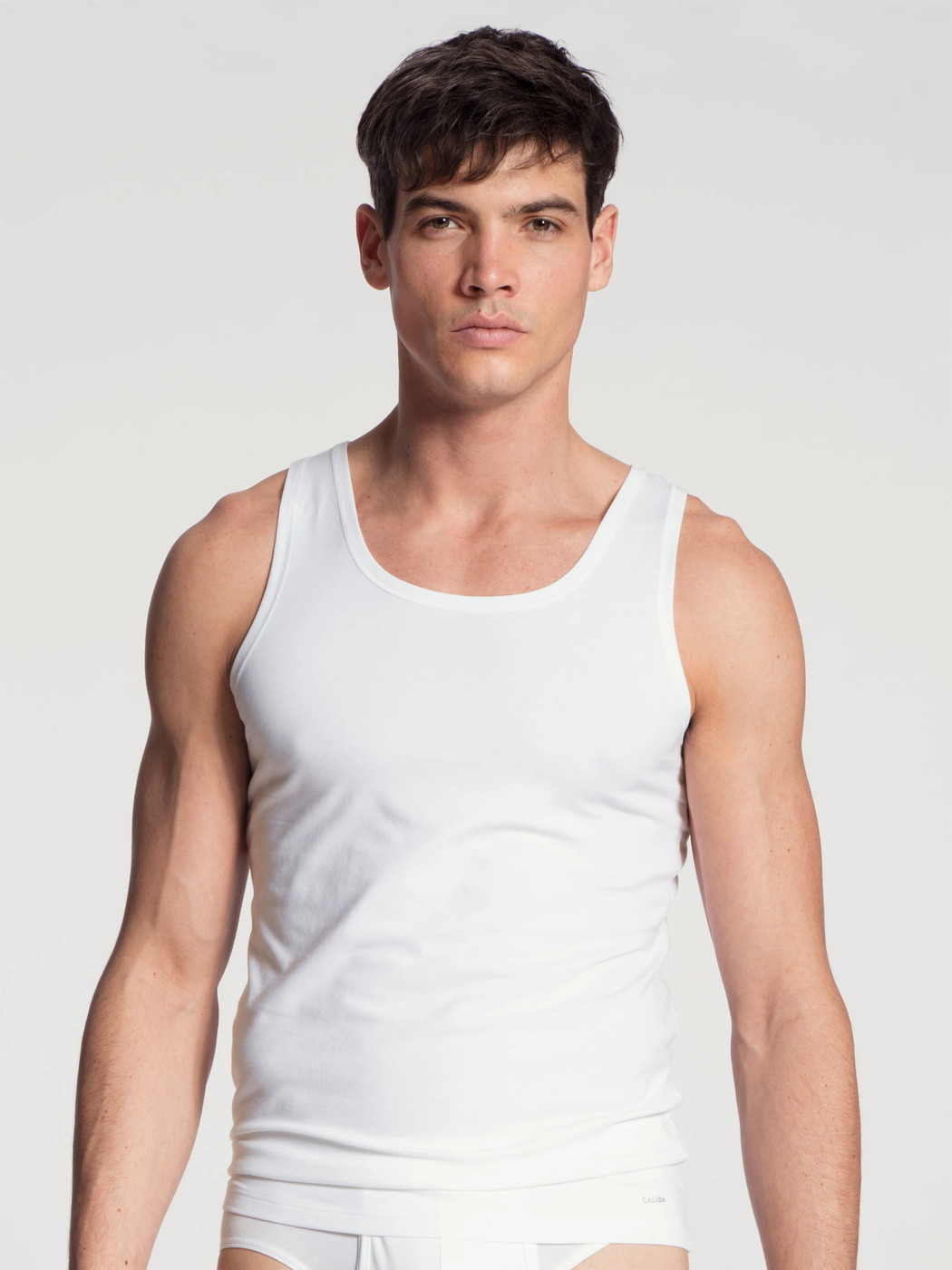 Men model is wearing Tank-Top made of Cotton in White, Unicoloured from the Cotton Code series by CALIDA, Front view