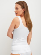 Women model is wearing Tank top made of Modal in White, Unicoloured from the Soft Favourites series by CALIDA, Back view