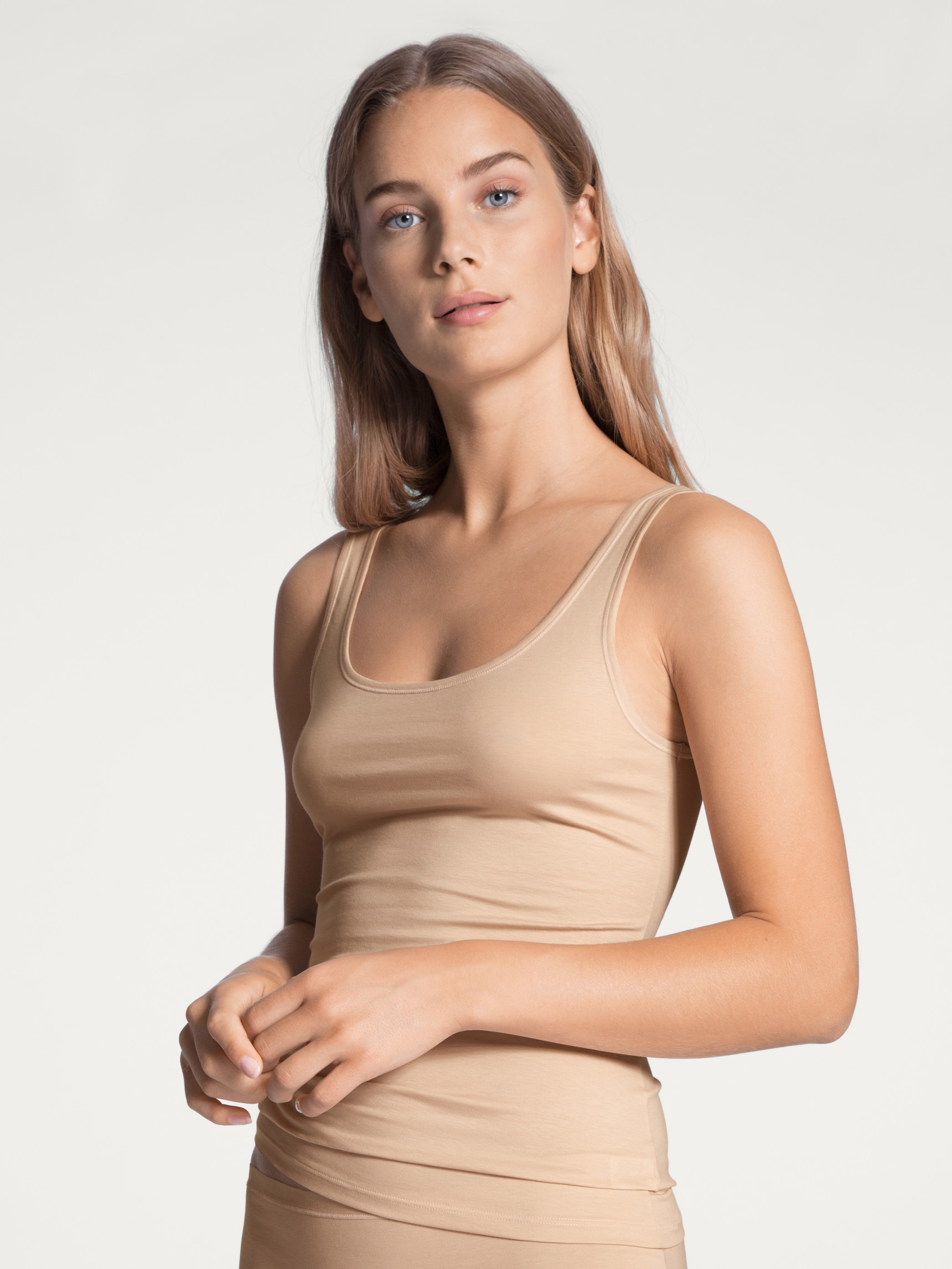 Women model is wearing Tank top made of Cotton in Beige, Unicoloured from the Natural Comfort series by CALIDA, Front view
