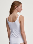 Women model is wearing Tank top made of Polyamide in White, Unicoloured from the Sleek Skin series by CALIDA, Back view