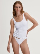 Women model is wearing Tank top made of Polyamide in White, Unicoloured from the Sleek Skin series by CALIDA, Outfit