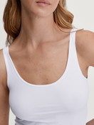 Women model is wearing Tank top made of Polyamide in White, Unicoloured from the Sleek Skin series by CALIDA, Detail