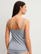 Women model is wearing Tank top with bustier made of Modal in Grey, Unicoloured from the Natural Skin series by CALIDA, Back view